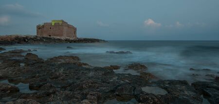 Famous Paphos medieval Castle close to the fishing harbor of Paphos late in the evening