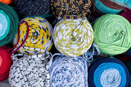 Rolled Stylish comfort and colourful blankets stored on top of each other. Rolled blankets in a...