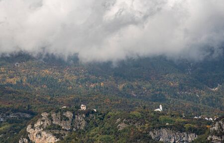 Idyllic mountain landscape with cloudscapes covering the mountain peaks at South Tyrol region in Italy,の写真素材