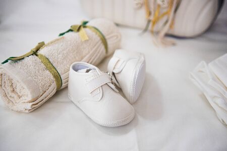 Newborn white  baptism shoes and soft towel for christeningの写真素材