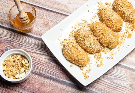 Delicious and tasty Greek  honey cookies with Walnuts called melomakarona , traditionally enjoyed during Christmas.の写真素材