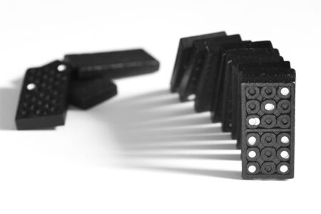 Black Domino blocks falling, isolated on white background