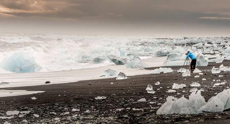 Unrecognised photographer capturing the ice chunks from the vatnajokull glacier during sunset in Icelandの写真素材
