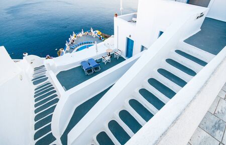 Traditional narrow stair street leading to the sea. Oia village, in Santorini Island, Greece. Landscape Greek islandsの写真素材