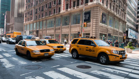 Midtown Manhattan street view with yellow taxis on the 5th avenue, New York, USA