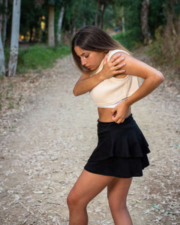 Young contemporary dancer and choreographer dancing outdoors Woman dancing in the environment.