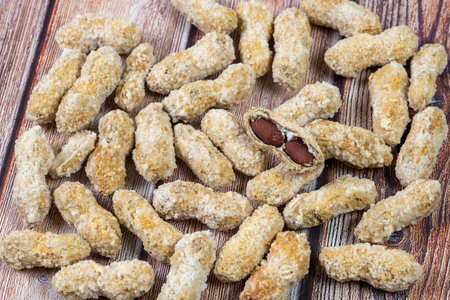 Salted healthy peanuts on a wooden surface