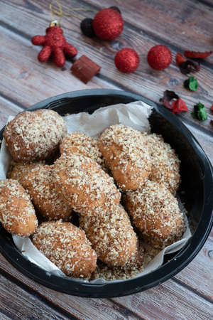 Traditional delicious Greek honey Christmas cookies melomakarona melomakarouno  with almonds and powered with honey and nutsの写真素材