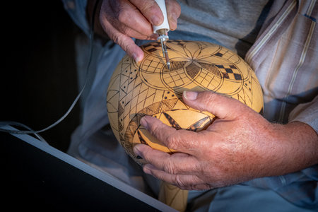 Professional artist maker working in workshop crafting on pumpkin. Creative people handmade craftsの写真素材