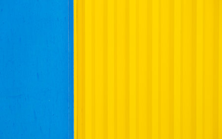Bright yellow colour and blue color painted metal.の写真素材