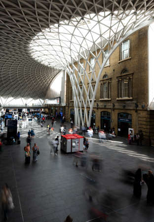 Interior of the London Kings Cross railway station. Rush hour with passengers walking in the place.のeditorial素材