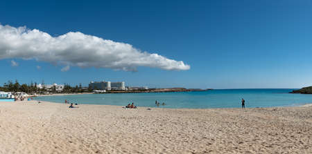 People resting in the empty beach due to Covid 19 pandemic. Nissi beach Agia Napa, Cyprusのeditorial素材