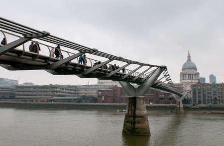 Skyline of London with the Millennium bridge St Pauls cathedral ant thames river in England.