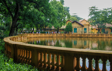 People walking near a lake at the Presidential palace gardens at Hanoi city in Vietnam Asiaのeditorial素材