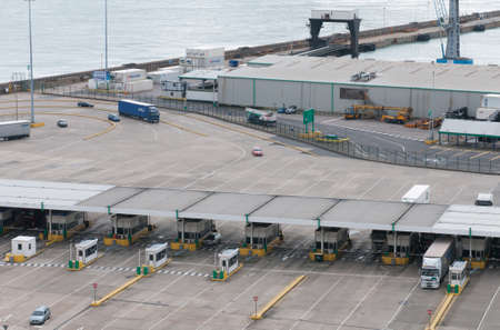 Trucks on Dover docks station before the customs to tranfer goods to France.のeditorial素材