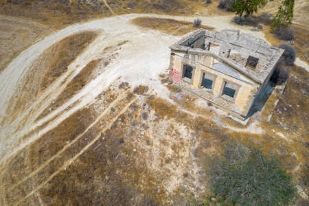 Aerial view drone photograph of an abandoned and deserted village with ruins of houses.の写真素材