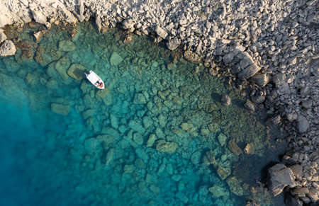 Drone aerial photograph of Cape Greko peninsulas. Boat in the oceanの写真素材