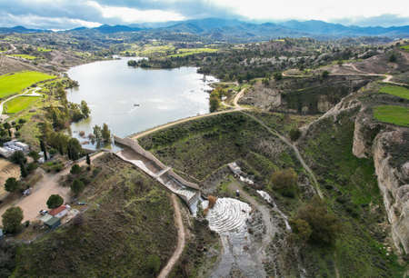 Drone aerial of water overflow of the dam after heavy rain. Water reservoir .の写真素材