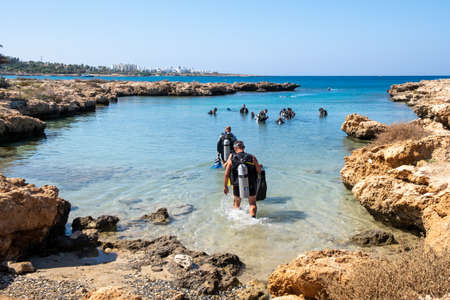 Divers with Scuba diving gear equipment in the sea for a diving lesson. Protaras Cyprusのeditorial素材