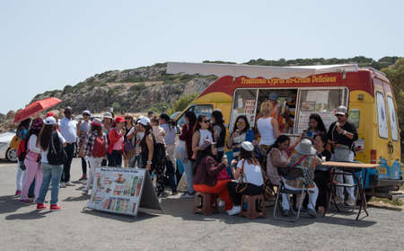 Group of tourist people enjoying delicious ice cream from a mobile business coffee van.のeditorial素材