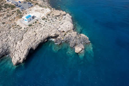 Drone aerial photograph of Cape Greko peninsula with Agyoi Anargyroi church on the rocks.の写真素材