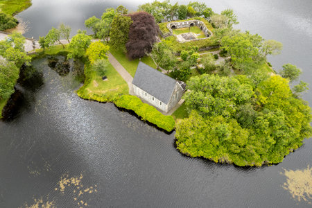 Aerial drone landscape of St. Finbarr oratory Church, Gougane Barra, cork West Ireland.の写真素材