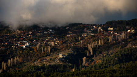 Mountain village covered in mist in winter. Prodromos Troodos mountains Cyprus.の写真素材