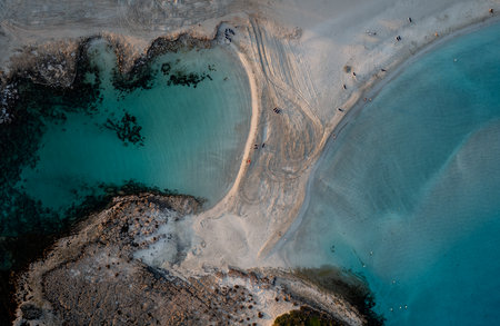 Aerial drone view of the coastline of empty beach in winter. Summer holidays.の写真素材