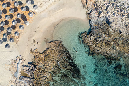 Drone aerial of beach umbrellas in the beach. Summer holidays in the sea.の写真素材