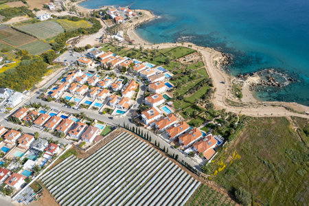 Drone aerial of holiday village with luxury houses at an idyllic rocky coast. Summer vacations at the sea. Protaras Cyprusの写真素材