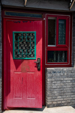 Traditional red house open door. Facade of a Chinese residence..の写真素材