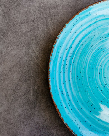 Empty blue ceramic food plate on a table. Food and drink. Copy space