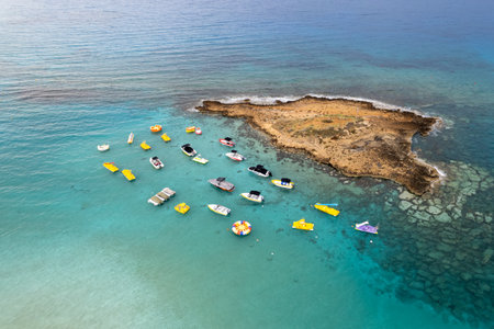 Aerial drone photograph of watersport boats moored anchored at the sea. fig tree bay beach Protaras...