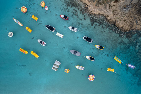 Aerial drone photograph of watersport boats moored anchored at the sea. fig tree bay beach Protaras cyprusの写真素材