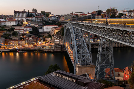 Cityscape of porto Portugal. Ponte de dom luis bridge at sunset. Douro river