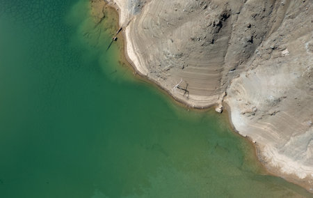 Drone aerial scenery of a toxic lake of an abandoned copper mine. Environmental pollution concept