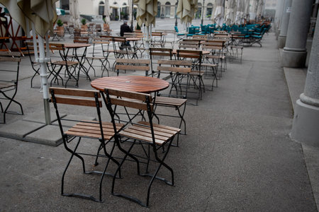 Outdoor cafe with empty tables and chairs during the day. Ljubljana city Slovenia
