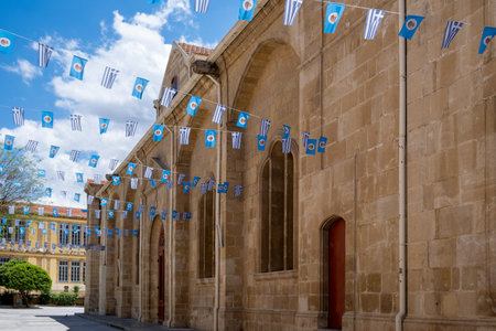 Greek flags hanging on christian church facade for independence day celebration in Cyprusの写真素材