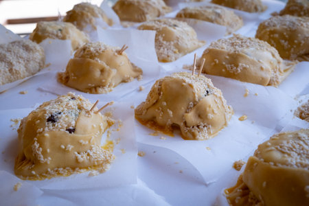 Easter cheese pastries flaounes ready to be cooked on a clay oven.