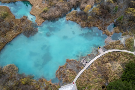 Aerial view of turquoise colored lake in autumn season.の写真素材