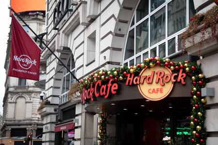 London, united Kingdom November 25 2025: Hard rock cafe entrance on piccadilly circus with festive christmas decorationsのeditorial素材