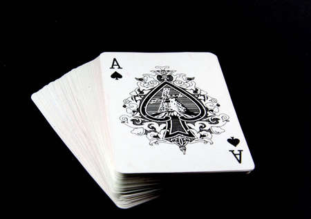 Playing cards on black background のeditorial素材