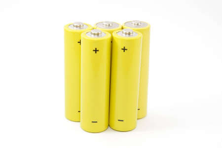 Yellow battery isolated on a white backgroundの写真素材