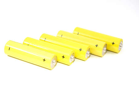 Yellow battery isolated on a white backgroundの写真素材