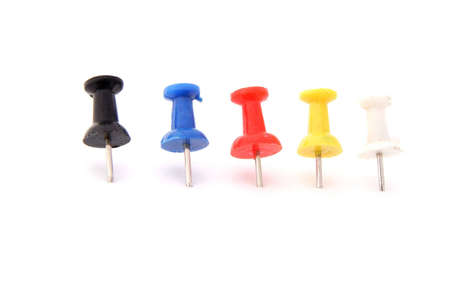Colored Pushpins on white background