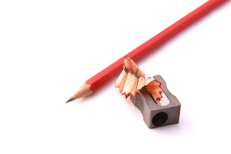Pencil with a shapner isolated on white backgroundの写真素材