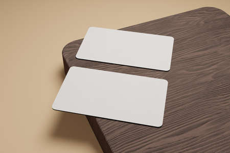 3d rendering of two business cards set on a piece of brown wood. this can be used to show the identity of you, your company or others.の写真素材