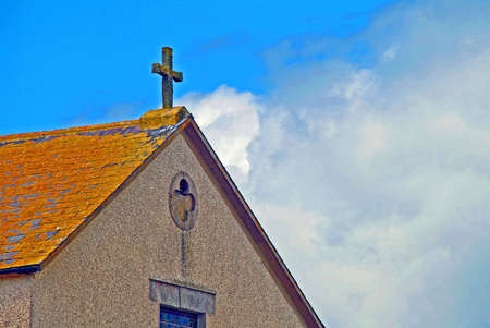 A Cross Set Againest A Blue Skyの写真素材