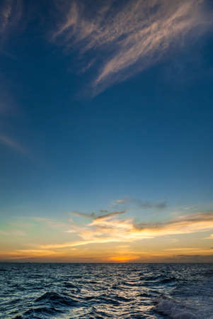 Scenic view of a sunset over the sea horizonの写真素材