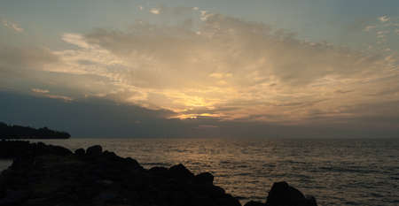 Scenic view of a sunset over the sea horizonの写真素材